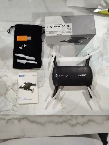 Elfie Worlds smallest foldable drone with four propellers, open frame and landing legs
