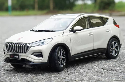 White 1:18 scale diecast SUV model car with black wheels and front grille.