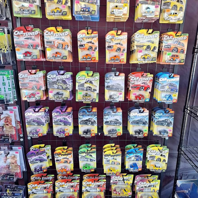 Car Tuned diecast toy cars in retail blister packs, multiple styles on display