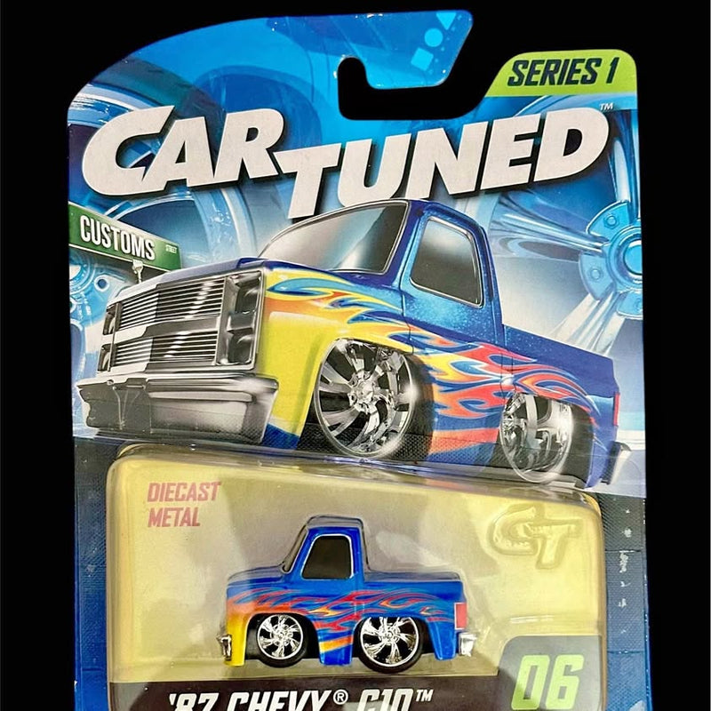 Blue 1:64 diecast custom Chevy C10 pickup truck with chrome wheels