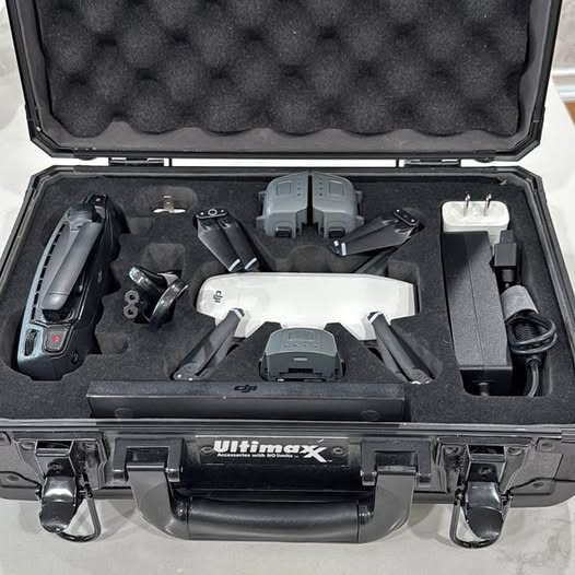 DJI Spark drone kit in black hard case with controller, cables, and spare batteries