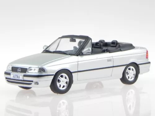 Silver convertible diecast model car, front three-quarter view, in display