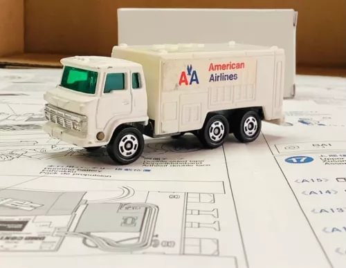 White diecast airport cargo truck with American Airlines A A logo and air unit