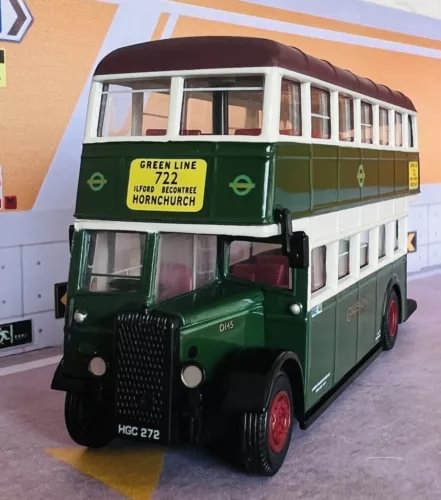 Green and cream diecast model bus with front grille and windows
