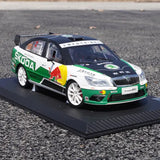 White and green racing car diecast model with front grille and Skoda livery
