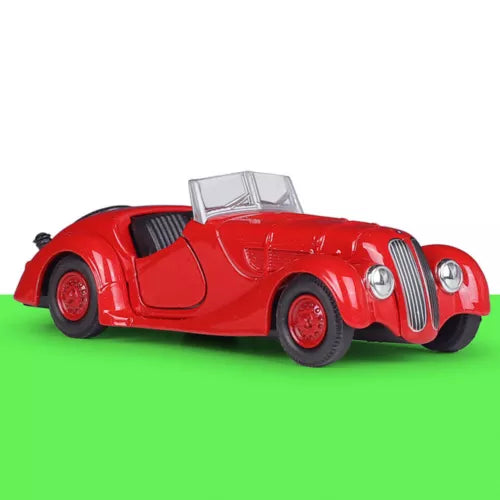 Red classic diecast model car with chrome grille and open hood