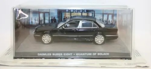 Diecast sedan car model in clear display box, dark gray with detailed wheels