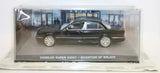 Diecast sedan car model in clear display box, dark gray with detailed wheels