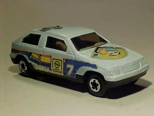 White and blue vintage diecast toy car with rally graphics, open windows