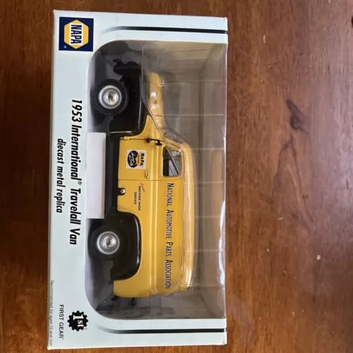 NAPA diecast delivery van model, yellow pickup-style van in clear blister box