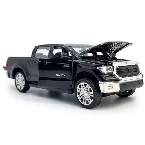 Black diecast pickup truck toy with open door and raised hood