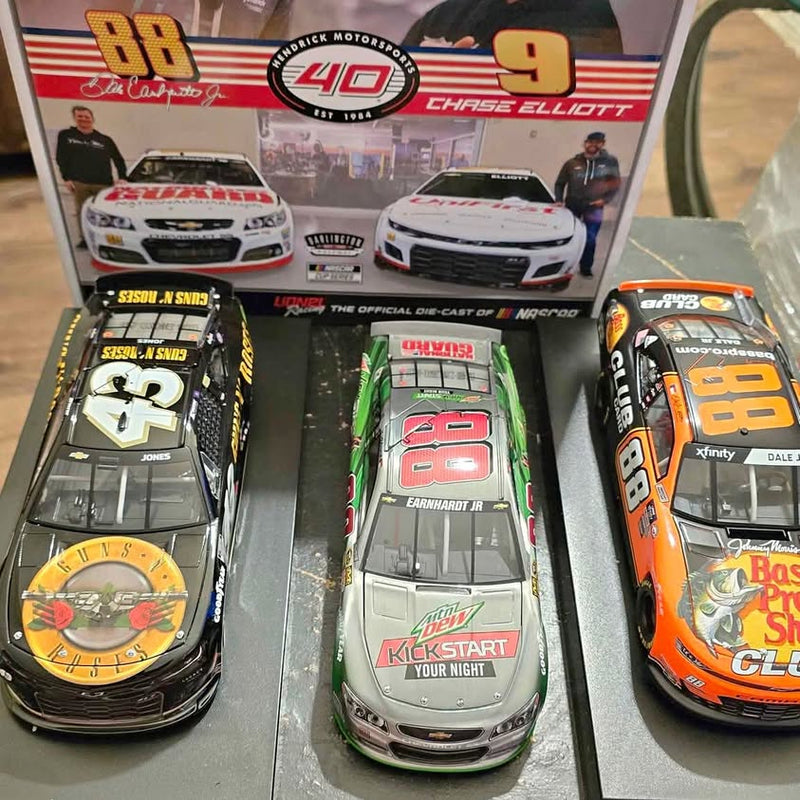 Diecast race car set with three boxed models, featuring numbers 88, 9, and 18.