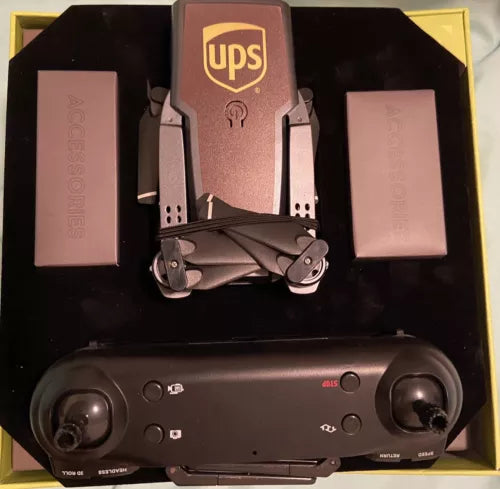 Foldable camera drone with UPS logo, dark body and twin front lenses