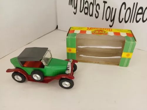 Green vintage diecast Opel 1924 model car with black seat and display box