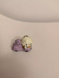 Diecast ice cream truck toy with two purple scoops and a beige scoop on top