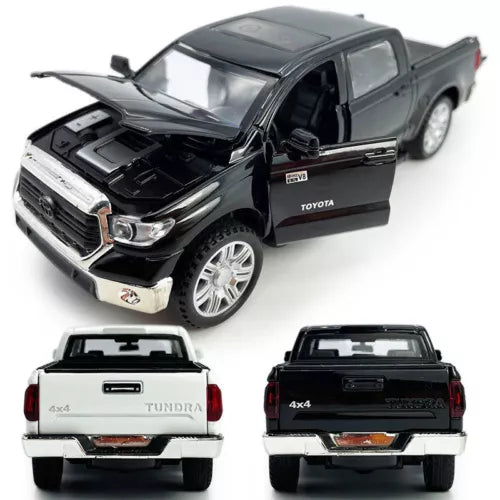 Diecast pickup truck model, dark gray with open hood and chrome grille, 4x4 wheels