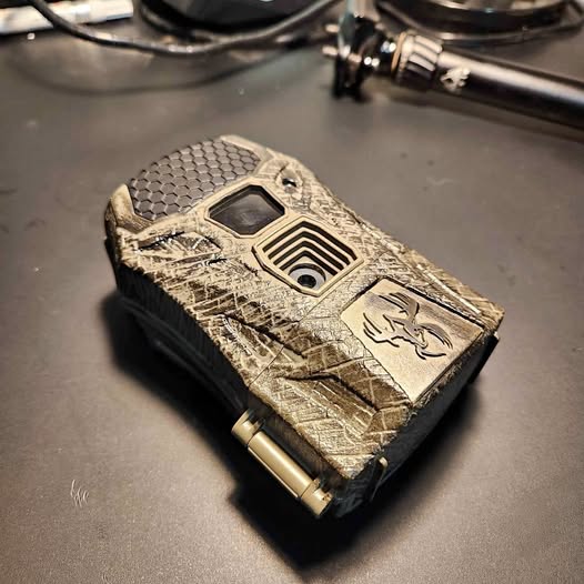Camouflage trail game camera with display window and control panel