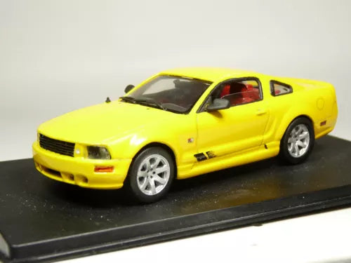 Yellow 2-door coupe diecast model car with black hood scoop and silver wheels