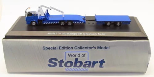 Blue Scania-style truck and rigid trailer diecast model on collector box