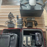 Foldable drone kit with controller, batteries, charger, cables, and hard case
