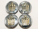 Diecast toy car wheel hubcaps with gold crown emblem, four-pack