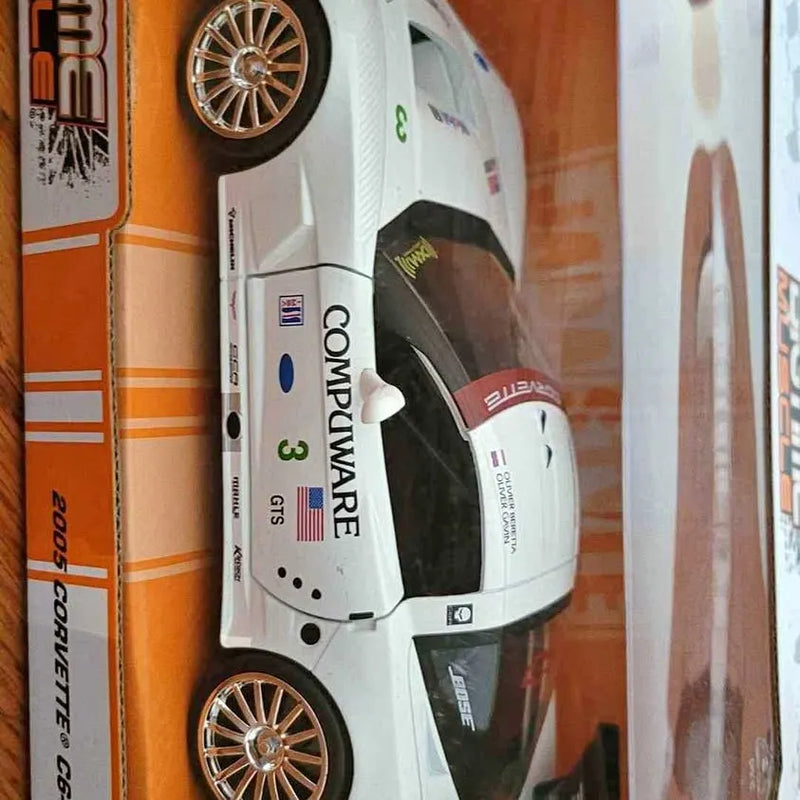 White 1:24 diecast race car toy with gold wheels