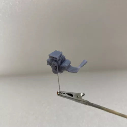 Diecast engine blower toy on metal support rod