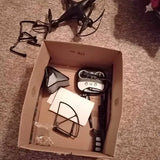 Boxed drone with propeller guards and controller pieces