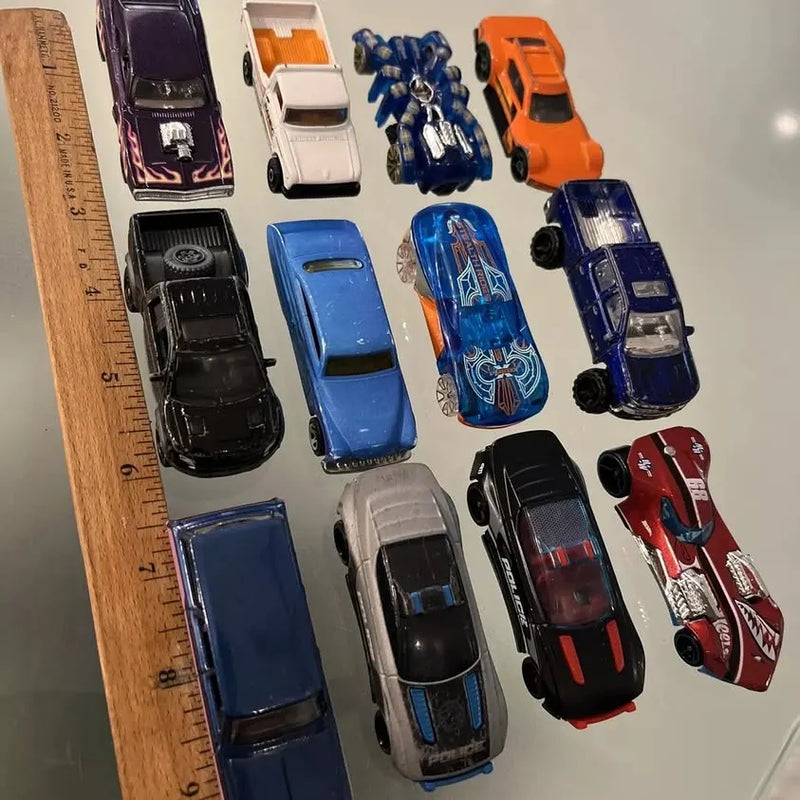 Diecast toy car lot with 12 model cars in blue, orange, black, and red