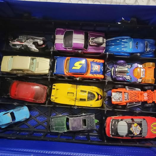 Assorted diecast model cars in red, yellow, orange, purple, blue, and white