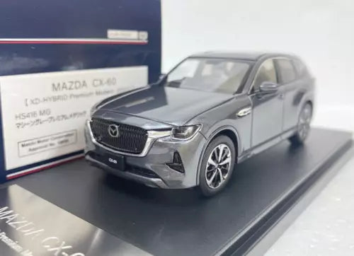 Gray Mazda CX-60 hybrid scale diecast model car, front three-quarter view