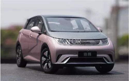 Pink electric diecast model car, front three-quarter view with black details
