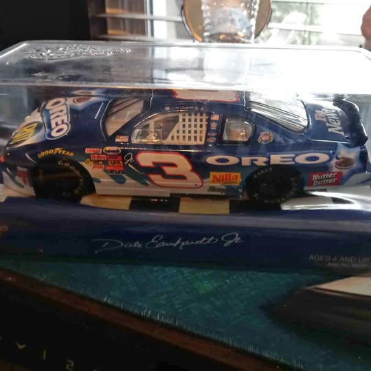 Dark blue diecast race car with Oreo logos and number 3 on hood