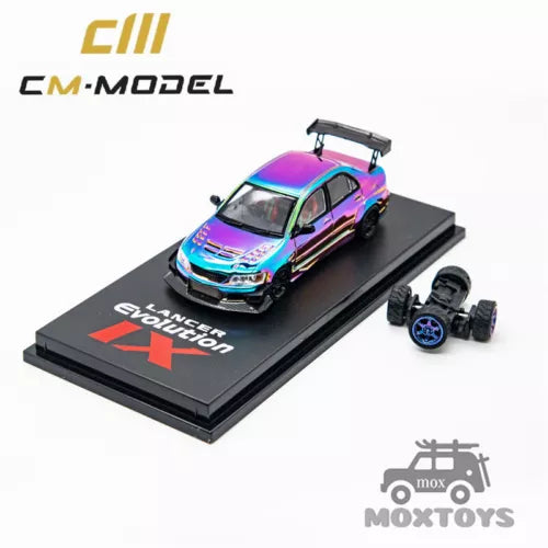 Iridescent purple-blue diecast model car on display base, with small accessory wheels