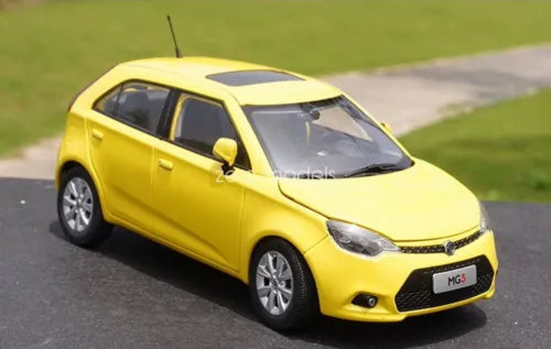 Yellow 1/20 scale MG3 diecast car model, front three-quarter view, black wheels
