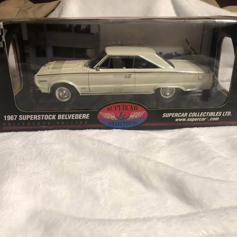 Classic diecast model car in clear display box, side view