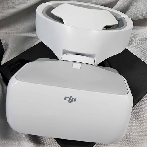 White DJI FPV goggles headset with front faceplate and headband