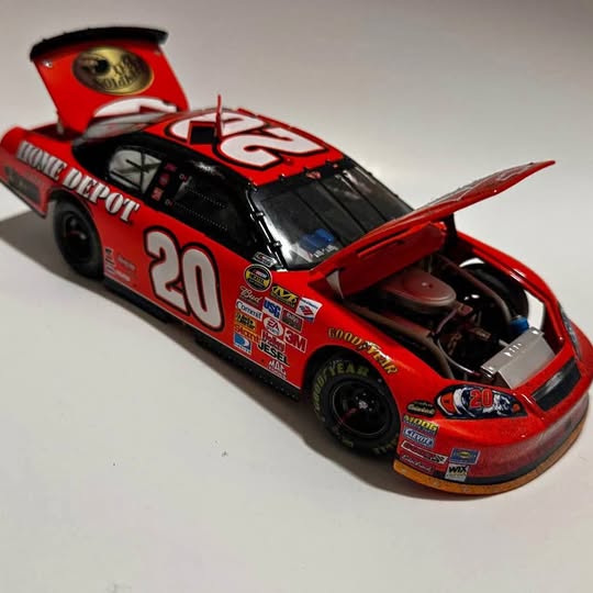 1/24 diecast NASCAR race car #20, red and black, open hood