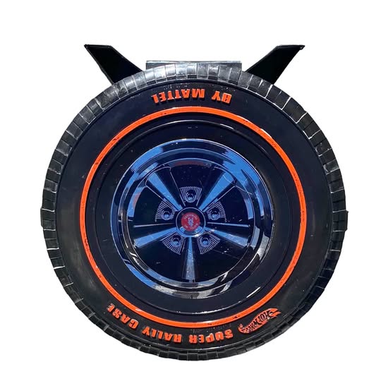 Blue diecast wheel with orange ring, detailed spokes, and black tire tread