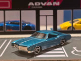 Teal 1966-style die-cast model car with chrome grille and front wheels