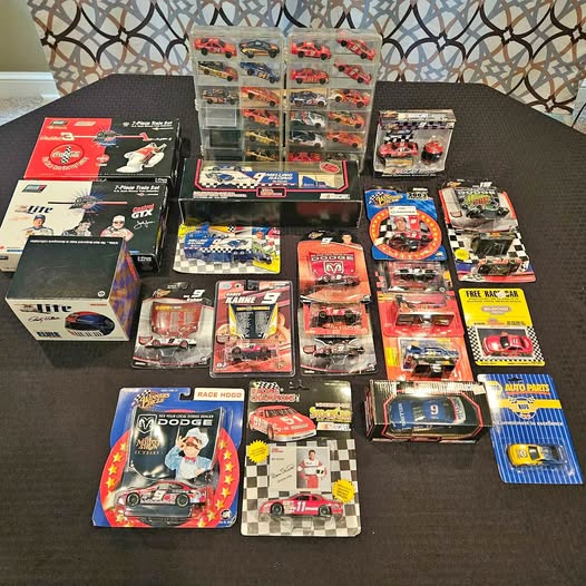 Diecast racing collectibles set with assorted blister packs and boxes for model cars