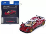 Red diecast model car with open cabin, in retail blister packaging