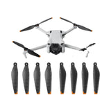 Carbon fiber drone propeller set with 4 blades on drone and 8 spare blades