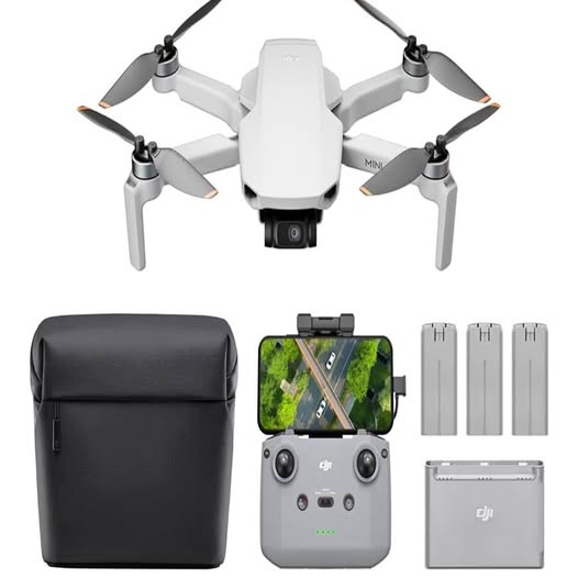 DJI Mini 4K drone with controller screen, spare batteries, charging hub, and black carrying case
