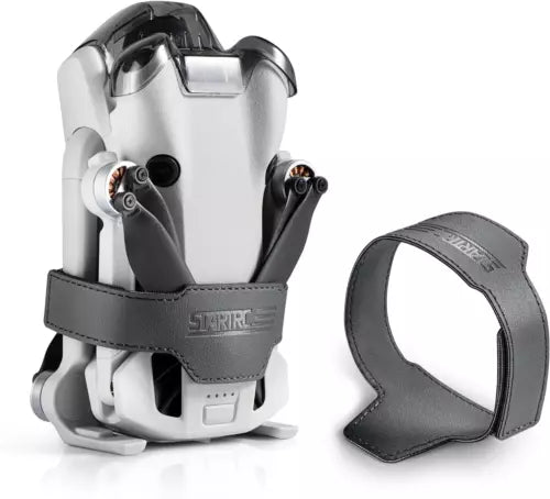 Drone propeller guard strap holder with gray frame and black strap