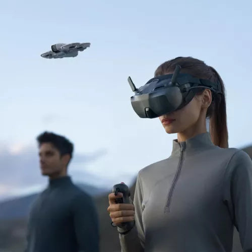 DJI FPV goggles on user, dark visor screen headset with head strap
