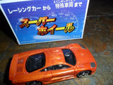 Orange diecast metal mini car, front three-quarter view