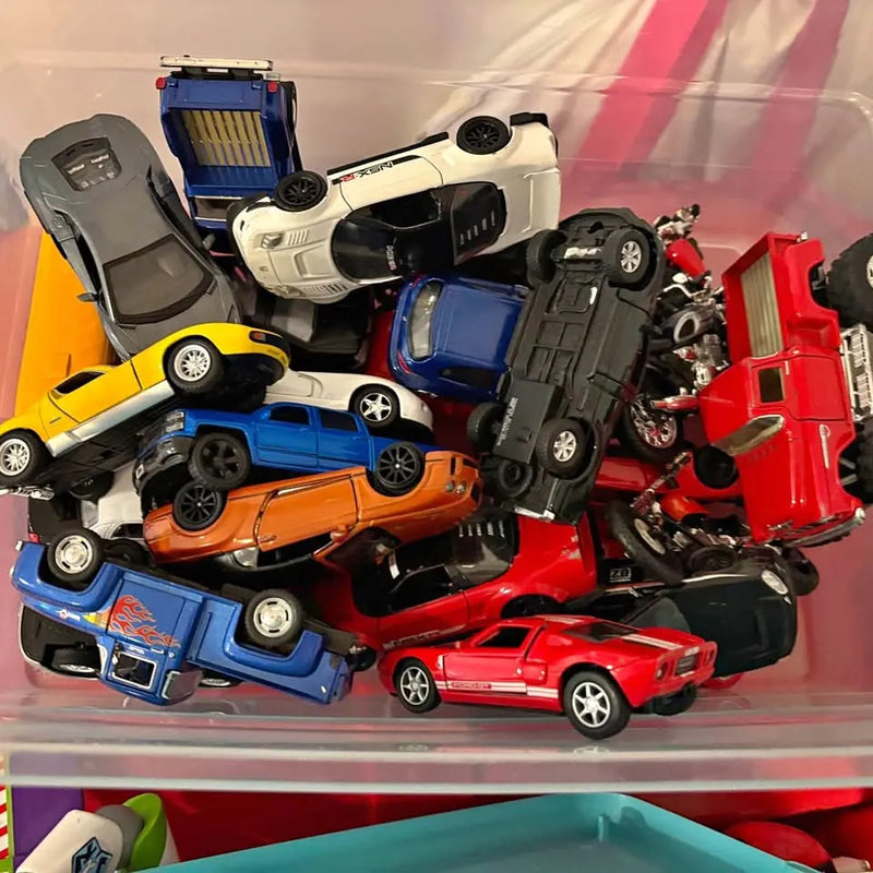Assorted die-cast cars and motorcycles set with mixed red, blue, orange, and black vehicles