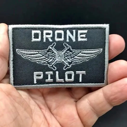 Drone pilot patch with Velcro back, dark fabric, winged drone logo and text