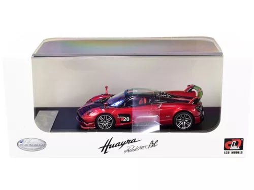 Red diecast model car with carbon stripe design, inside display case